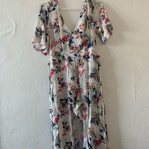 A romper with a long train and open back.